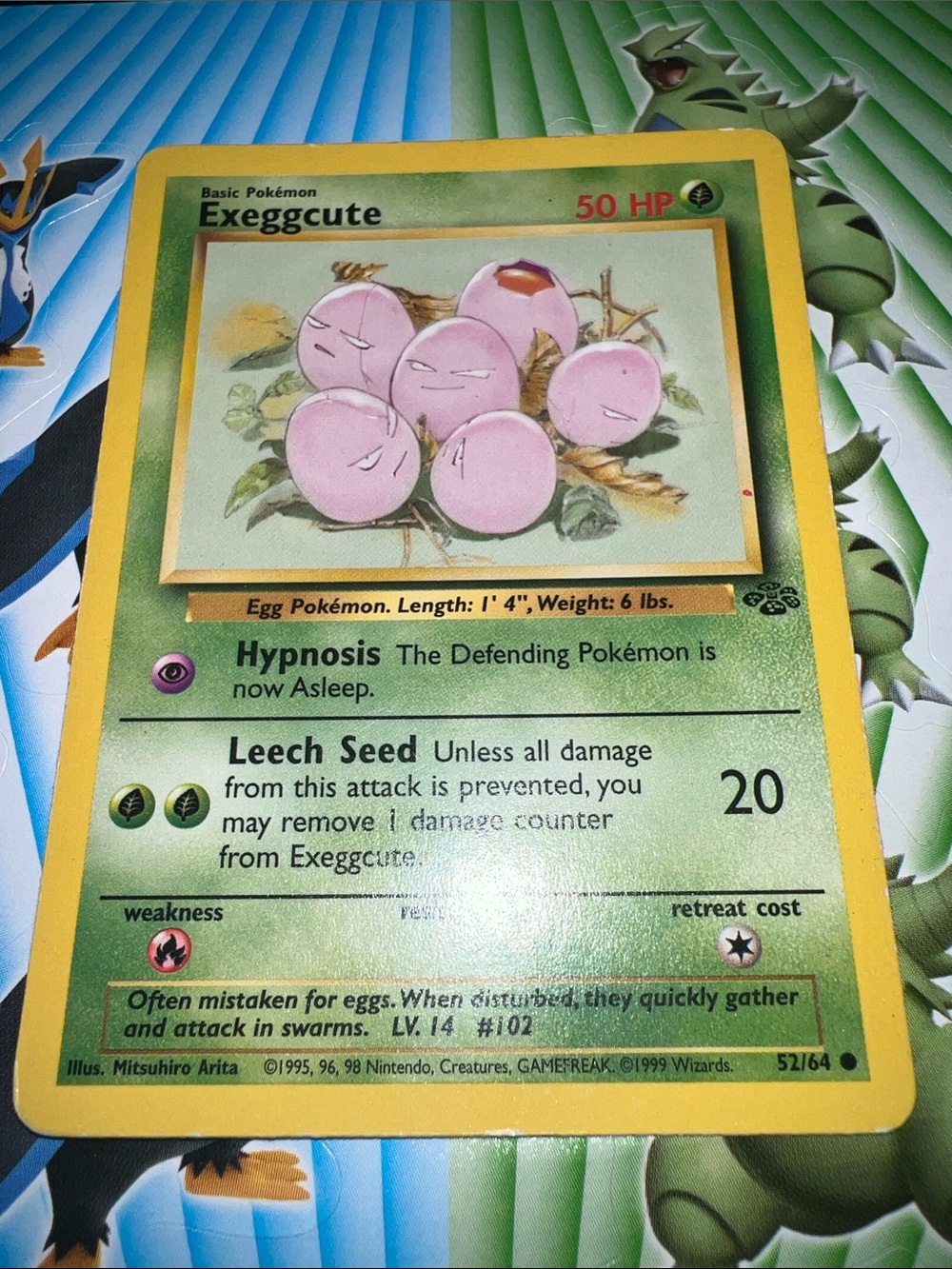 Pokemon Exeggcute Card — Pink Eggs with Yellow Border and Green Card Face